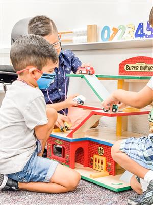 3 boys playing cars