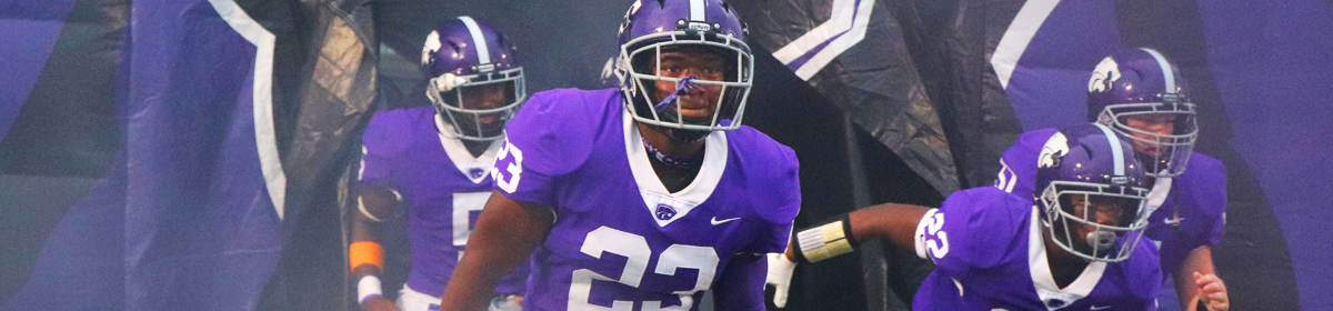 football players running out to the field 